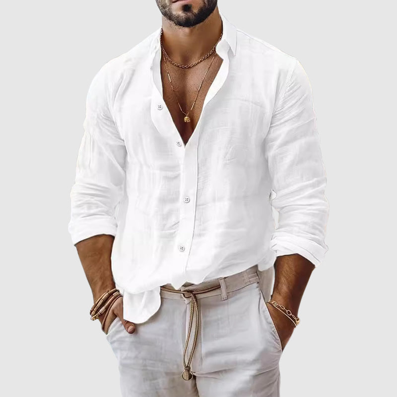  Female model wearing a breezy button-up shirt with a clean open neckline.