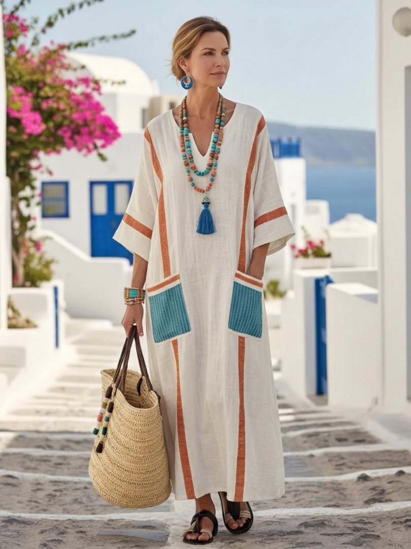 Long sleeve pocket maxi dress shown on a plain background.