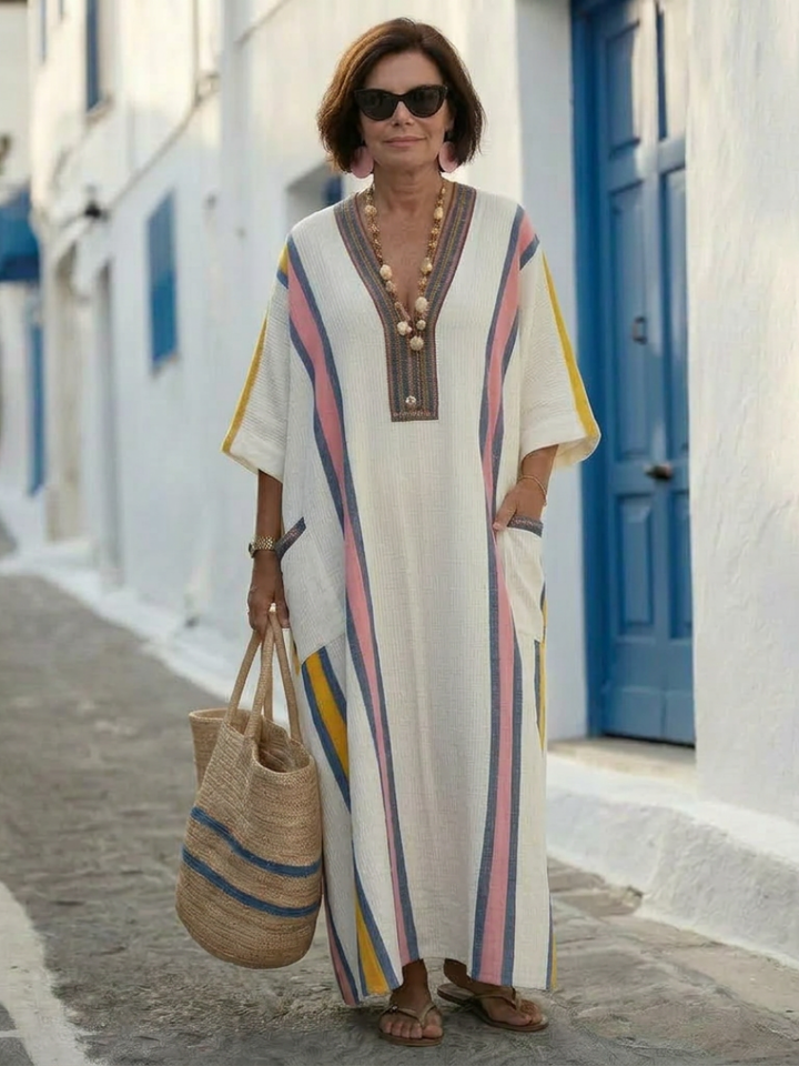 Women’s long pocket dress displayed on a plain background.