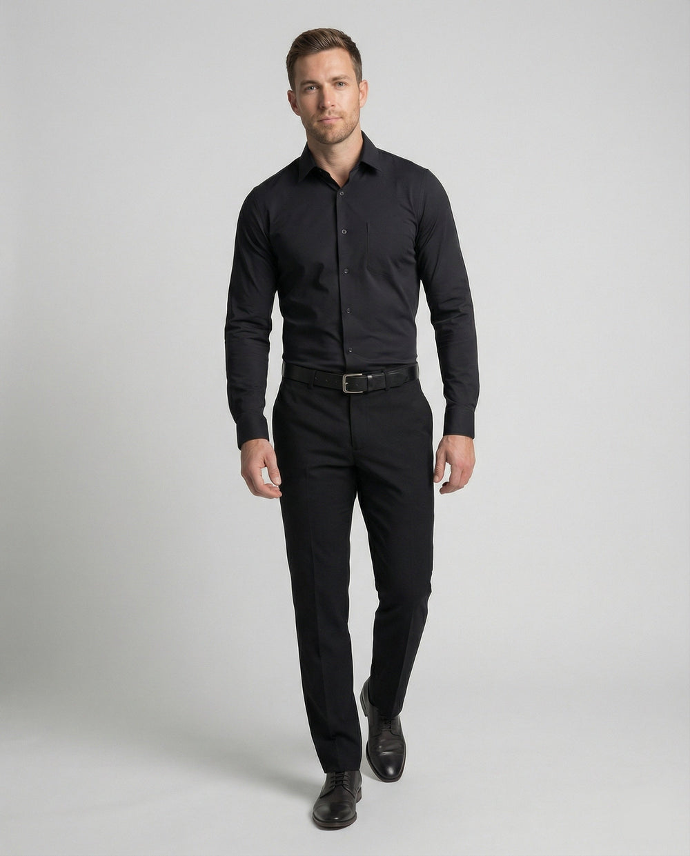 Male model in a clean business shirt against a plain background.