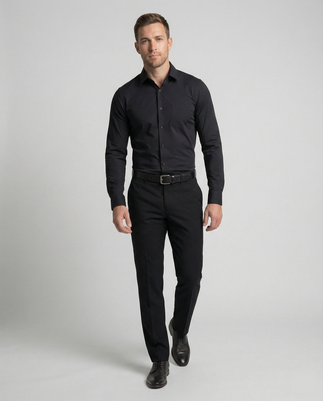 Male model in a clean business shirt against a plain background.