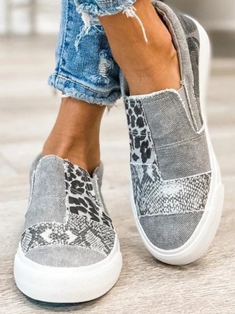 Trendy elevated sneakers with leopard and snake design