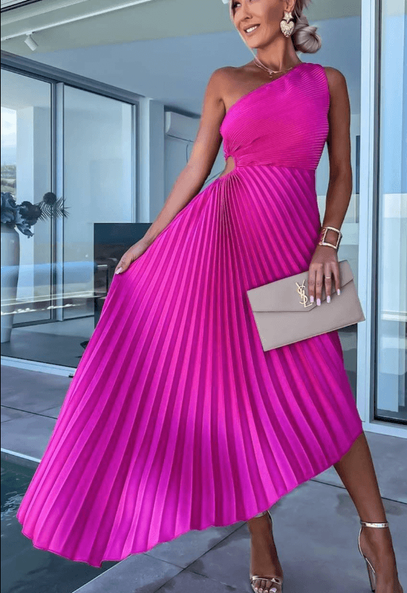 Female model front view in elegant dress with warm background.