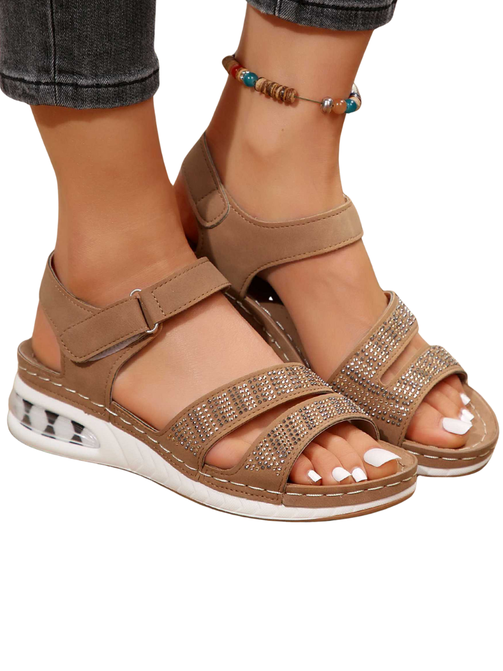Side angle foot wearing open toe wedge sandals plain background
