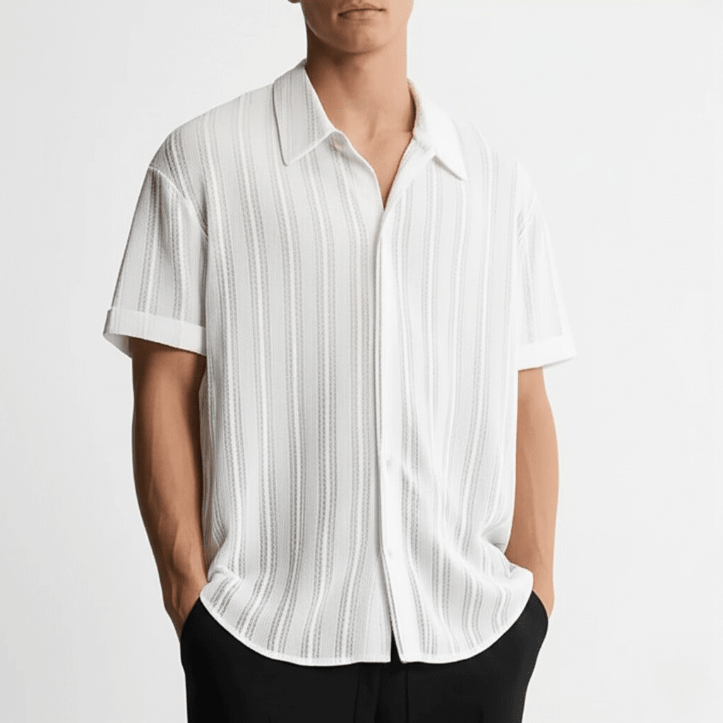  Male model wearing a collared short sleeve shirt on a plain background.