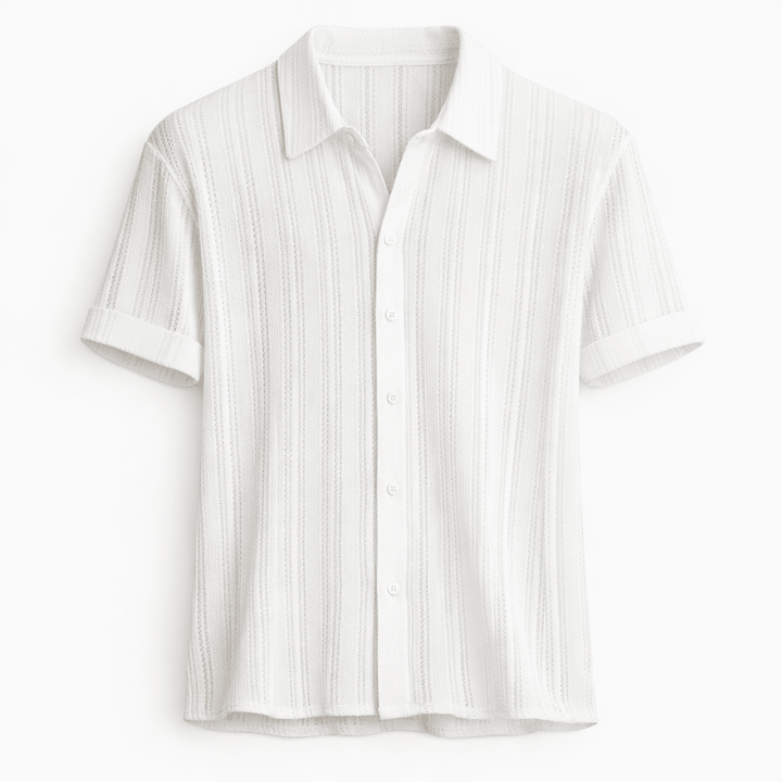 A  relaxed short sleeve shirt on a plain background.