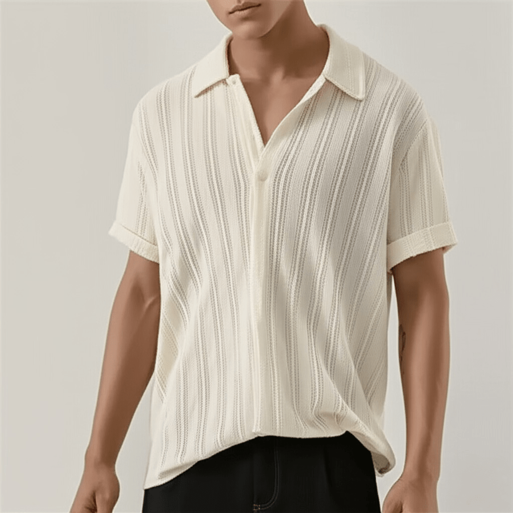  Man showcasing a button front shirt with a classic collar on a plain background. 