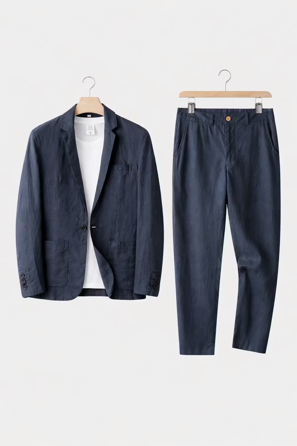 A modern blazer and trouser combination on a plain background.
