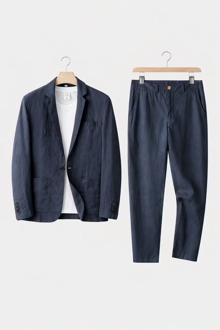 A modern blazer and trouser combination on a plain background.