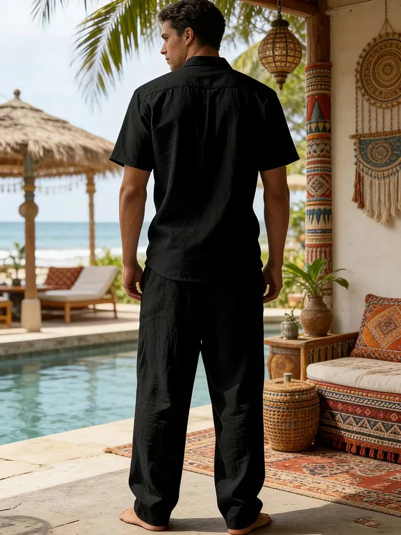  Man displaying a casual holiday-inspired outfit on a plain background.