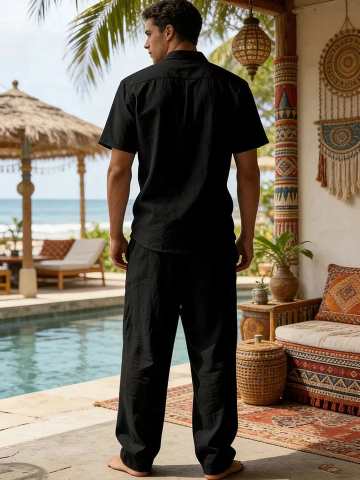  Man displaying a casual holiday-inspired outfit on a plain background.