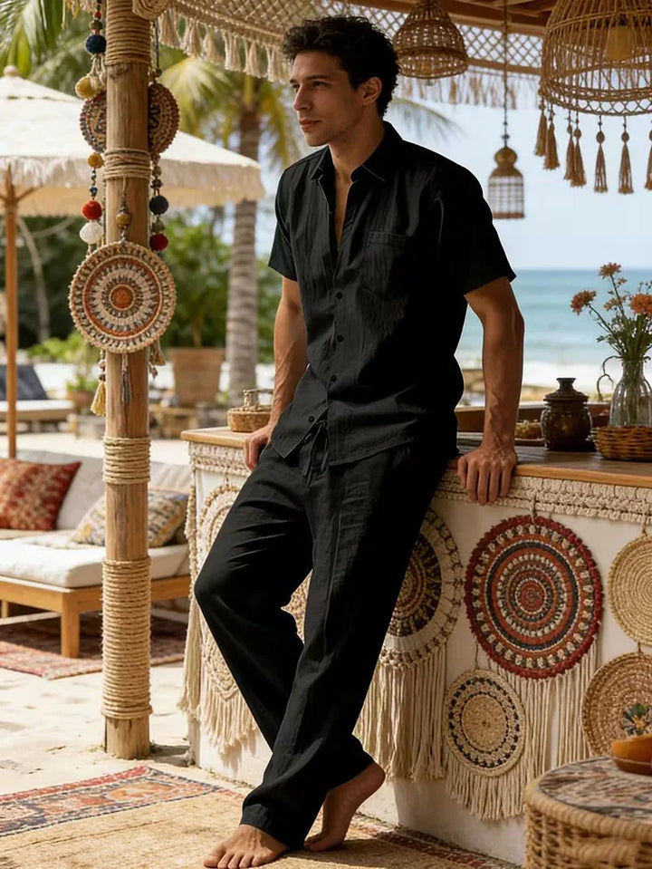  Male model wearing a smart casual summer set on a plain background.