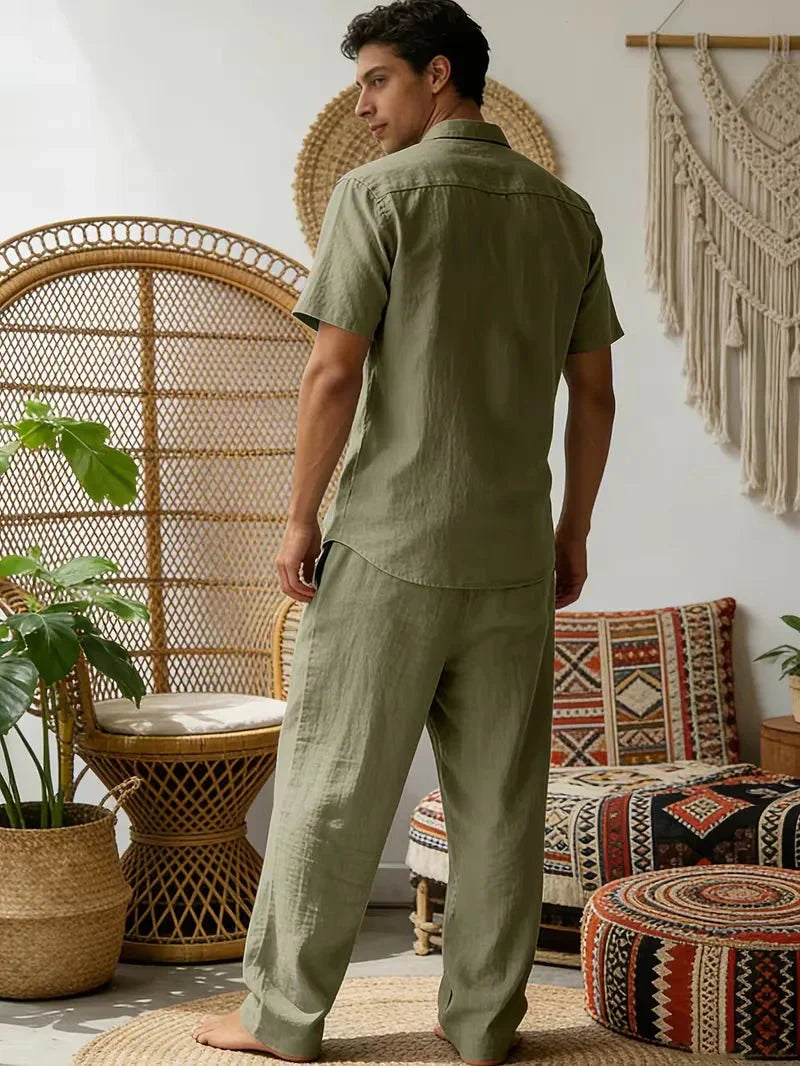 Male model presenting a relaxed men’s outfit on a plain background.