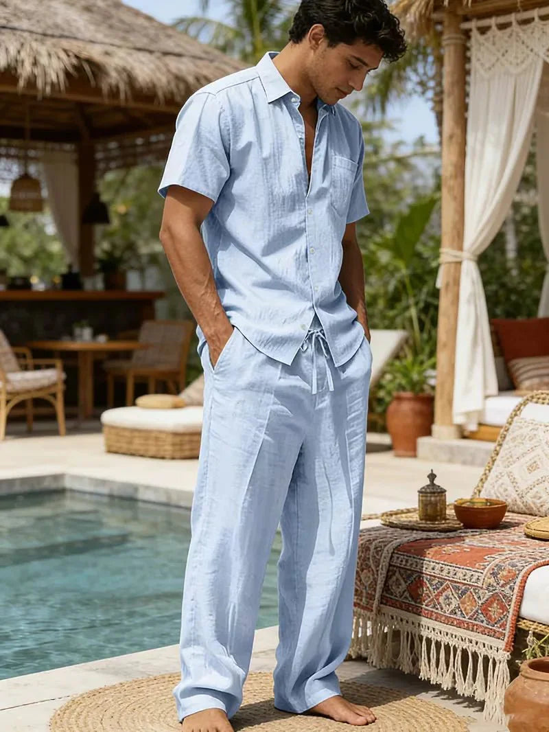  Male model showcasing a comfortable seasonal two-piece outfit on a plain background.