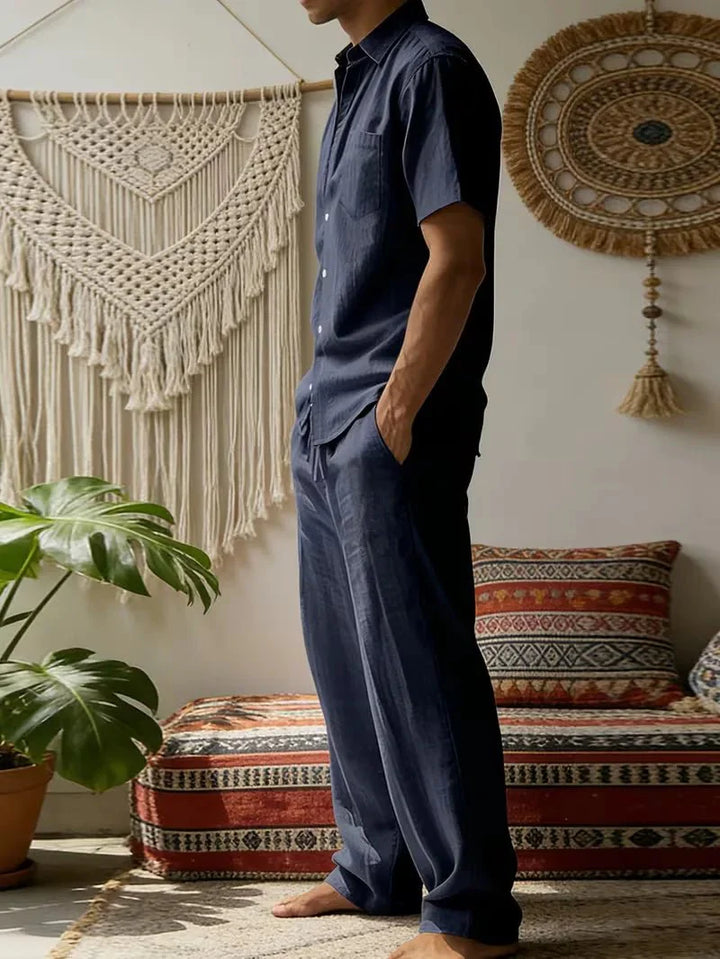  Male model showcasing a casual two-piece outfit on a plain background.