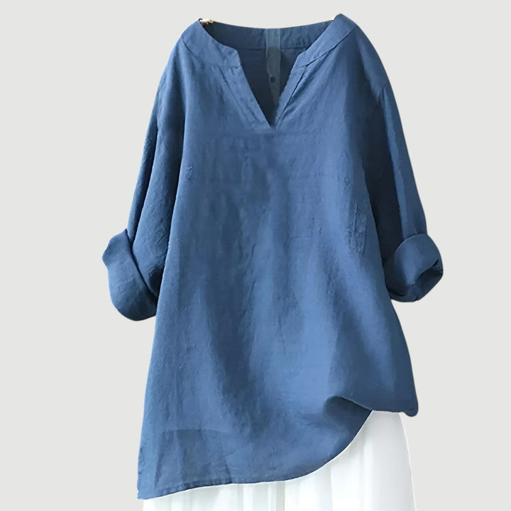 Model wearing oversized breathable shirt on a plain background