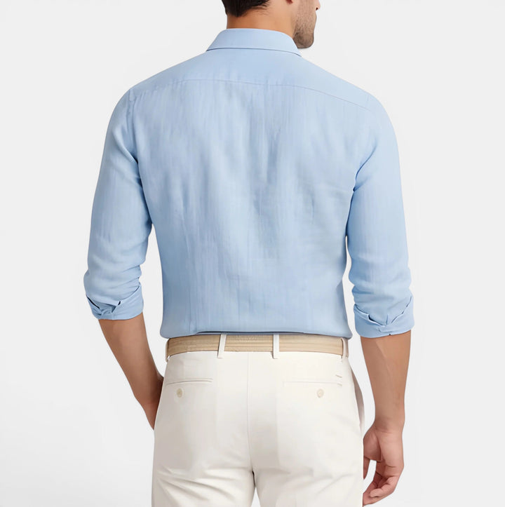  Male model presenting a modern button-up shirt against a plain background.