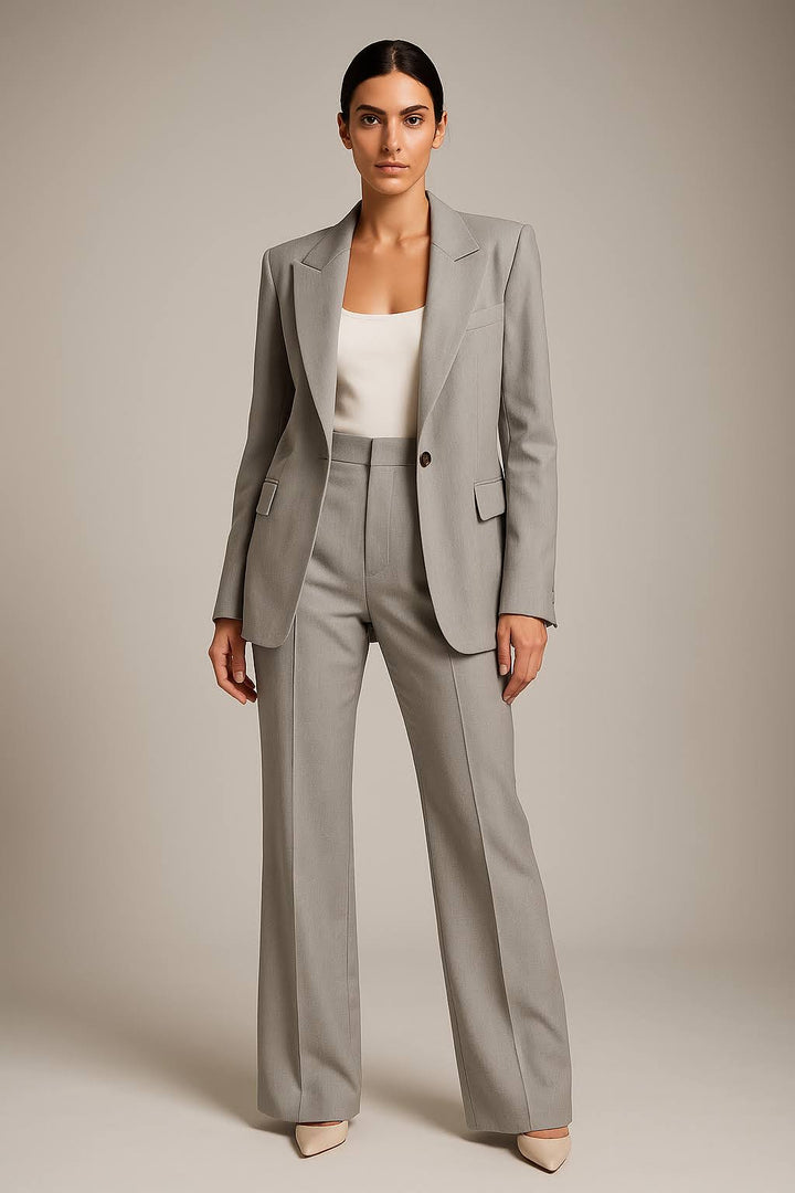 Female model showing a two piece blazer and trouser outfit with clear lines.