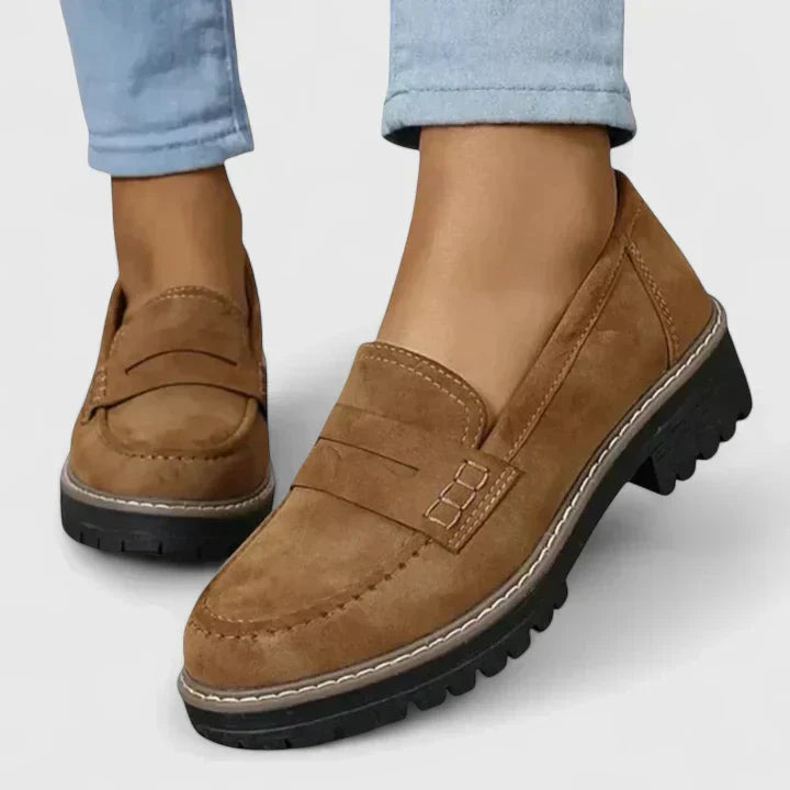 Close-up brown shoe upper with penny strap detail