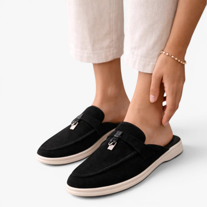  Lightweight slip-on loafers with almond toe shape on a plain background.