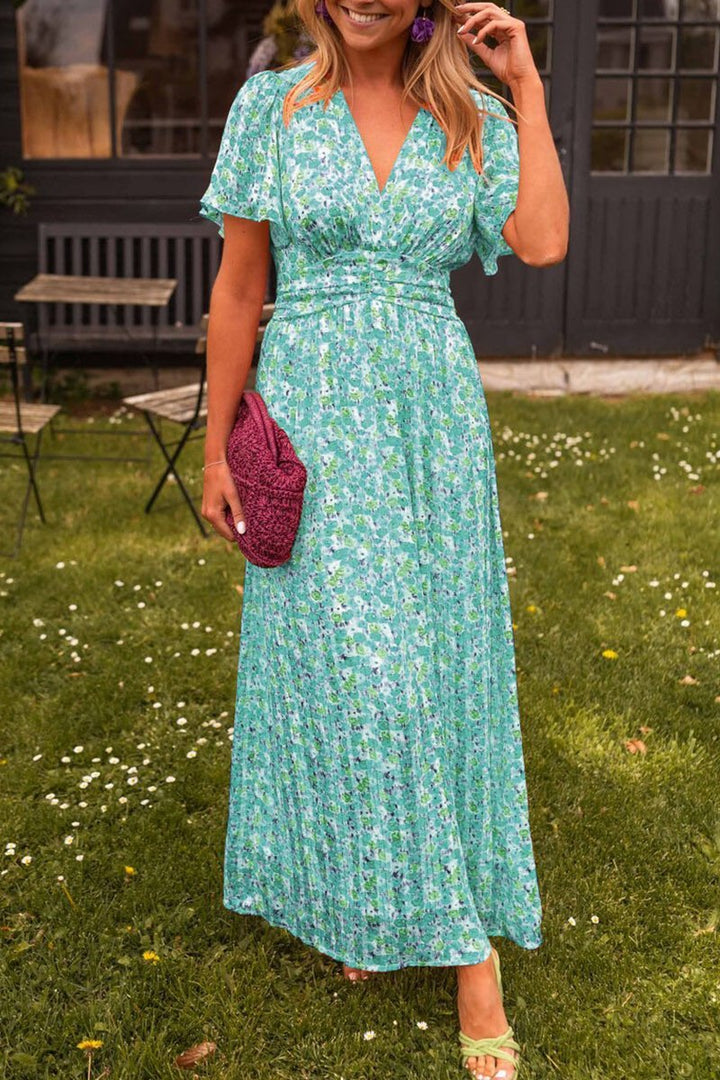 Font pose wearing colorful garden event dress