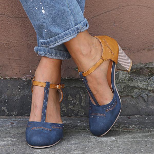 Front view of stylish closed-toe sandals on plain background.