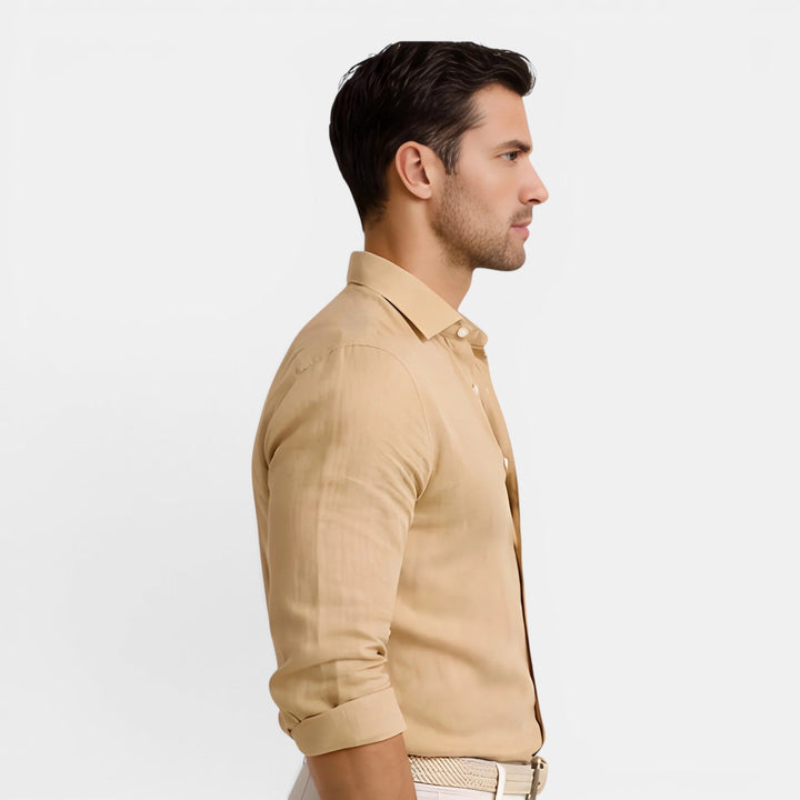 Male model wearing a lightweight collared shirt with a streamlined appearance.