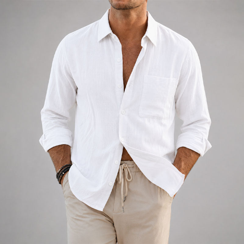  Woman wearing a laid back collared shirt on a plain background.