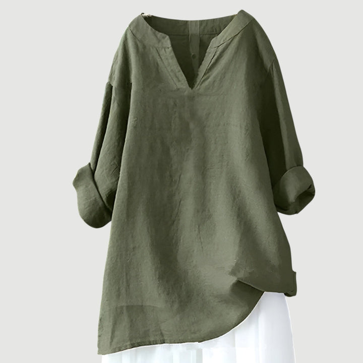Female in airy casual shirt with relaxed fit on clean background