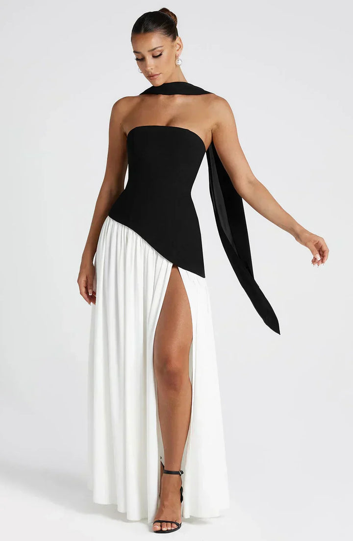 Model showcasing full-length occasion dress on plain studio background.