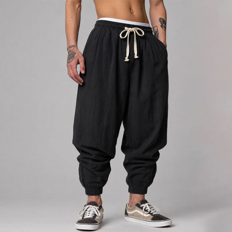 Model wearing breathable casual pants with a modern tapered shape on a plain background.
