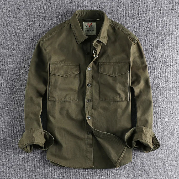 A casual utility-inspired long sleeve shirt on a plain background.