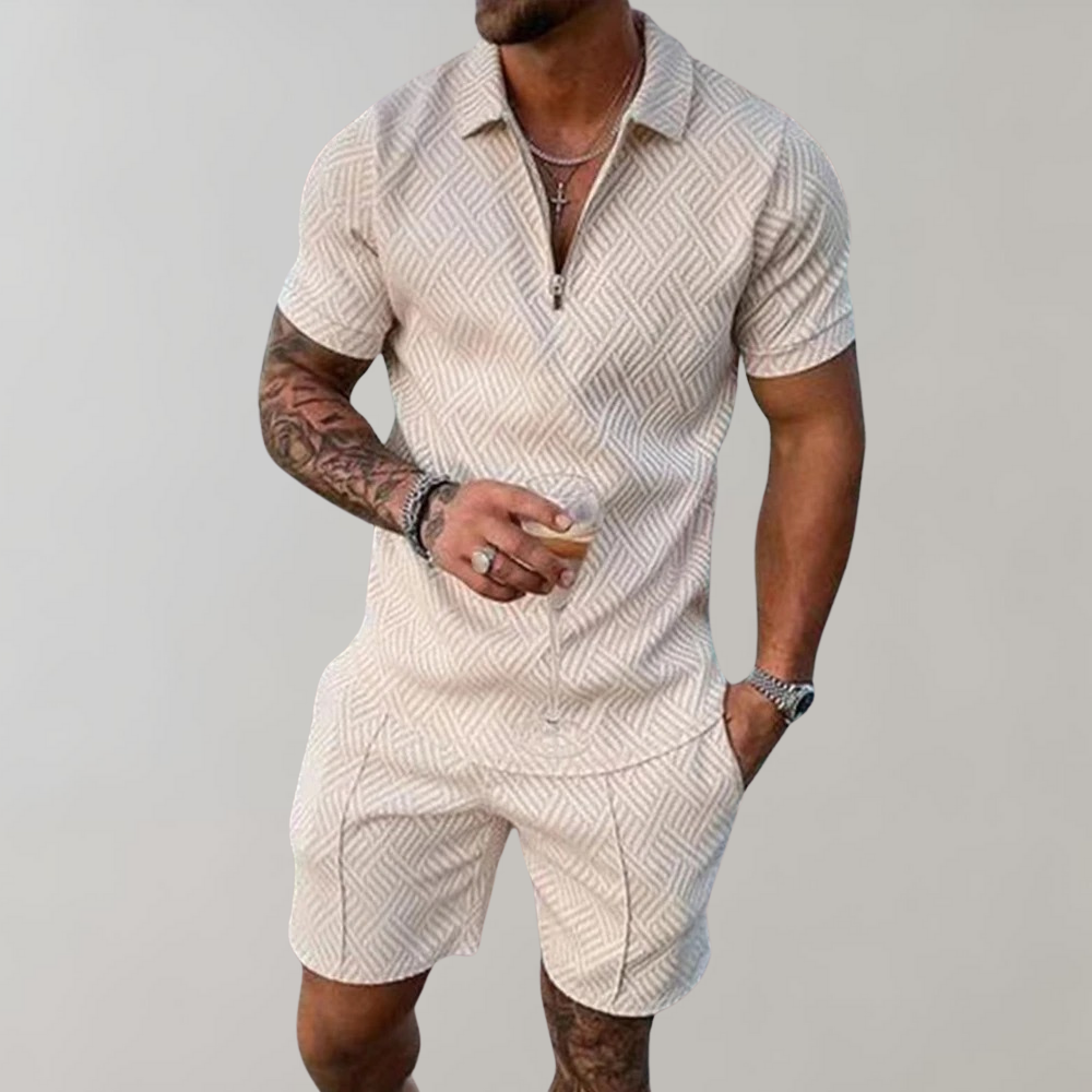  Male model showcasing a casual matching top and shorts outfit on a plain background.