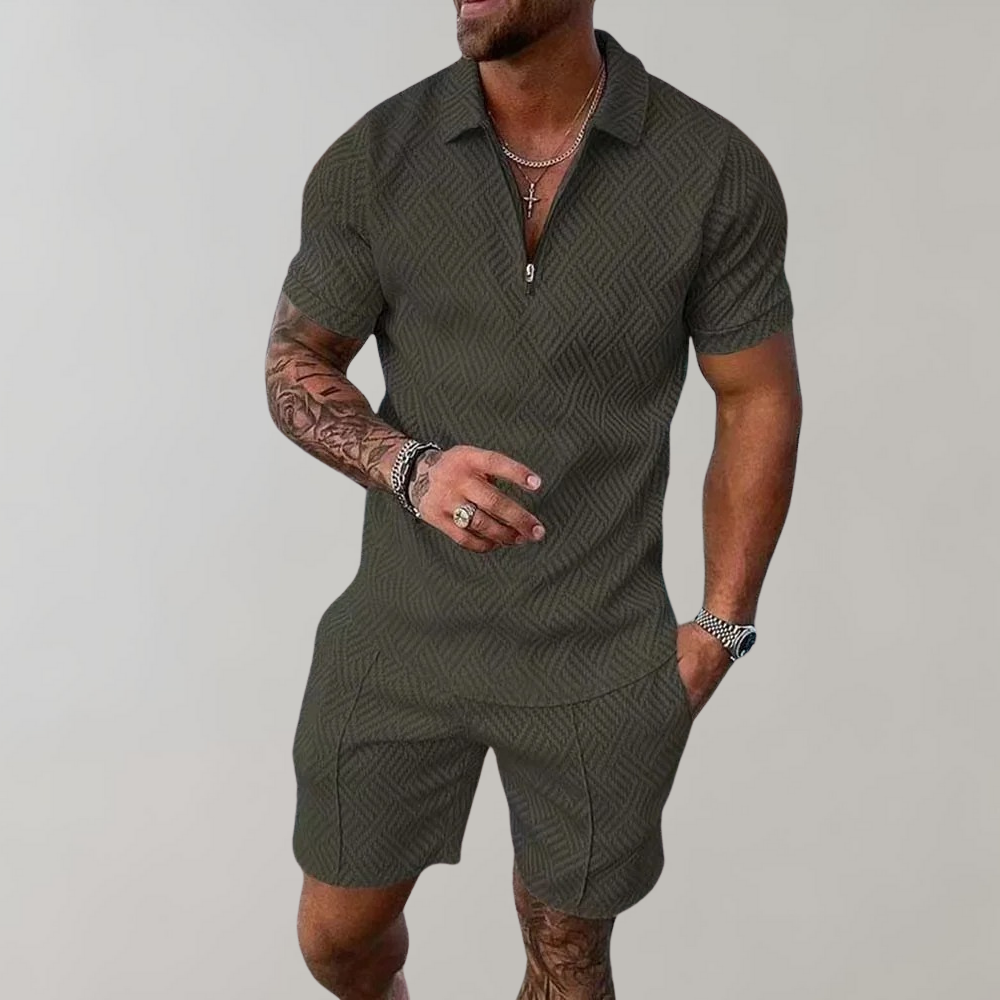 Man dressed in a coordinated short-sleeve polo and shorts set against a plain background.