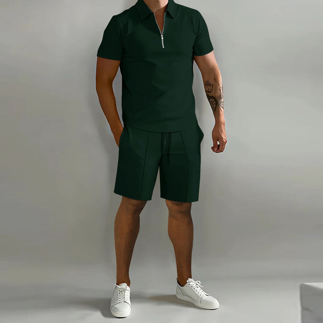 Male model wearing a coordinated warm-weather shirt and shorts set on a plain background.