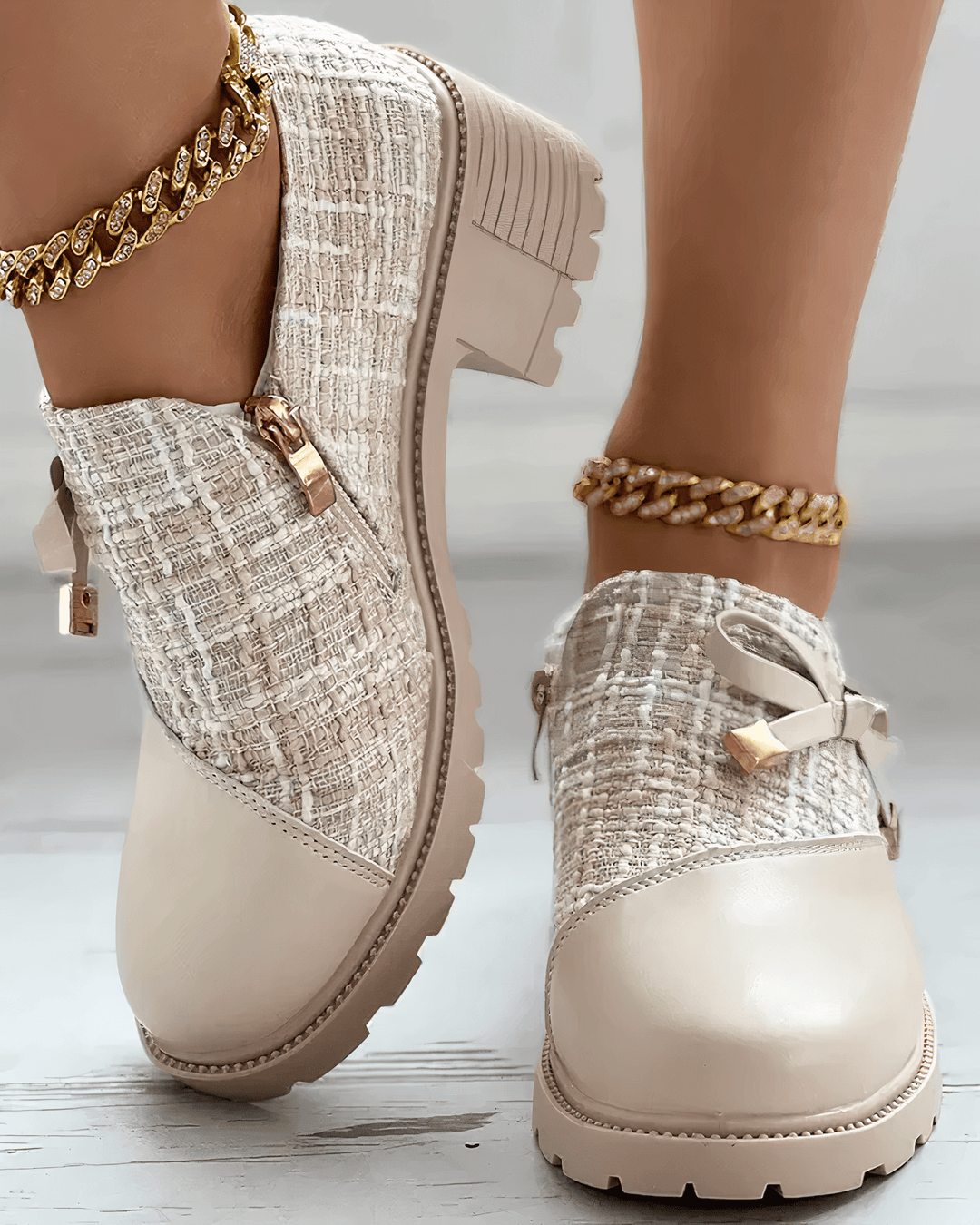 Front angle foot model showcasing rounded toe loafers plain background