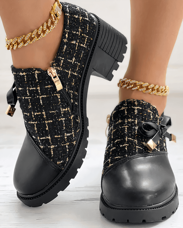 Front up foot model featuring rounded toe loafers plain background