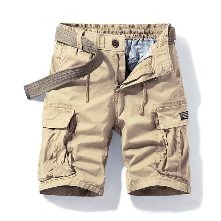  Male model showing relaxed cotton cargo shorts with a clean everyday look.