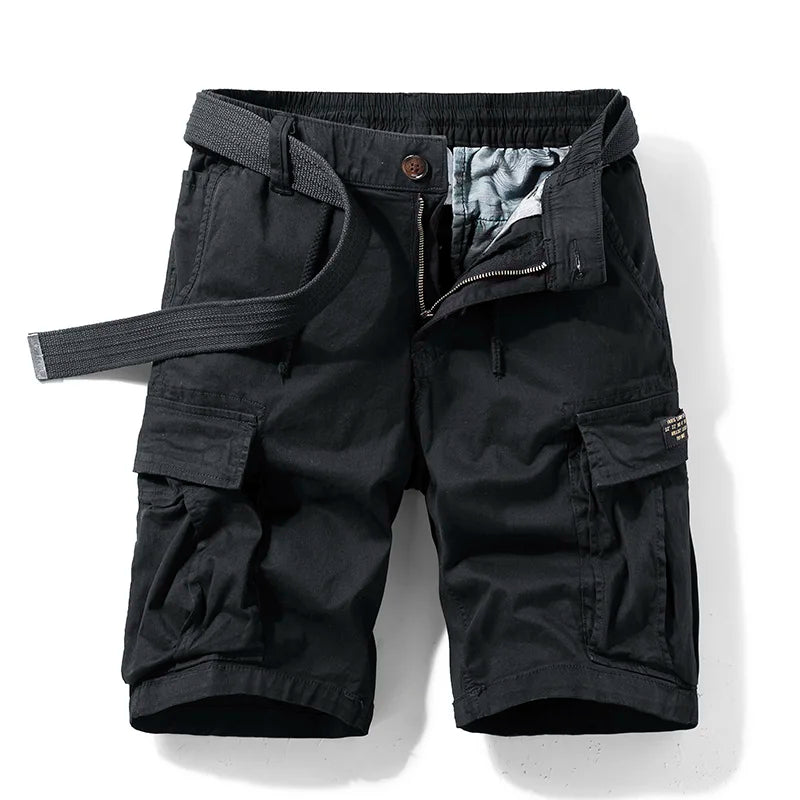  Model wearing utility-style cotton cargo shorts against a plain background.