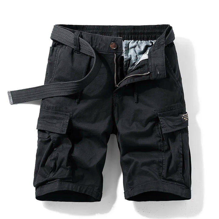  Model wearing utility-style cotton cargo shorts against a plain background.