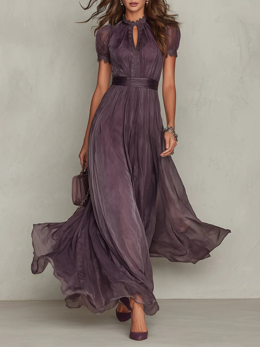 Female model wearing a long purple formal dress against a plain background.