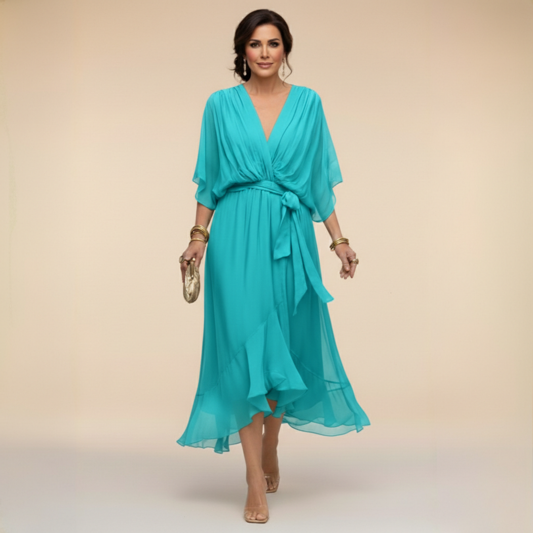 Female wearing a polished V-neck midi dress against a plain background.