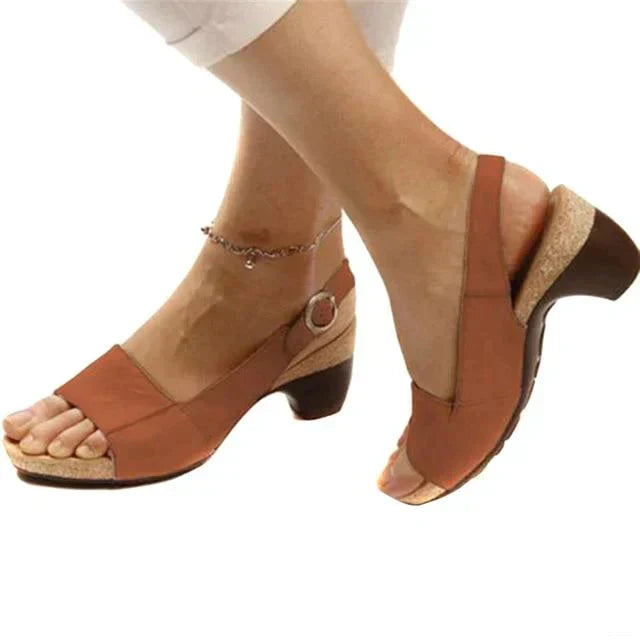 Side view of sandals worn naturally on foot model