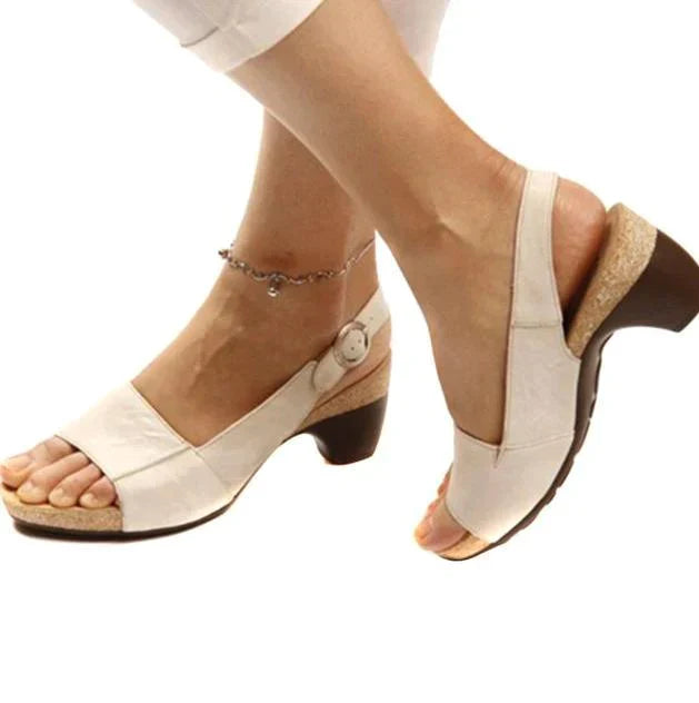 Minimalist white background showcasing sandals on foot model clearly