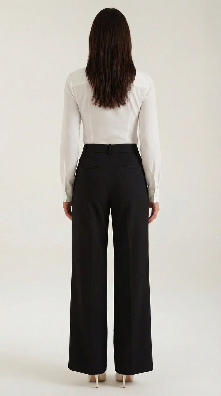 Back view woman in high-rise trousers clean plain background, back view