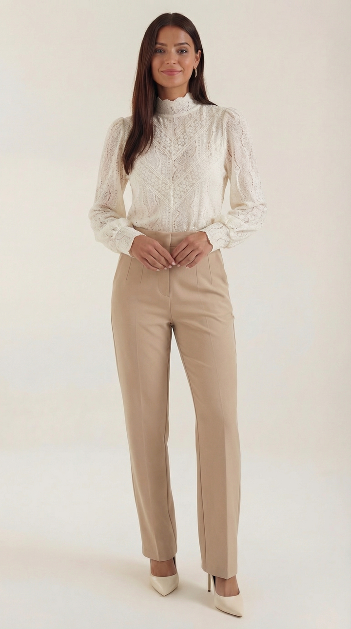 Woman wearing textured blouse front view on plain background