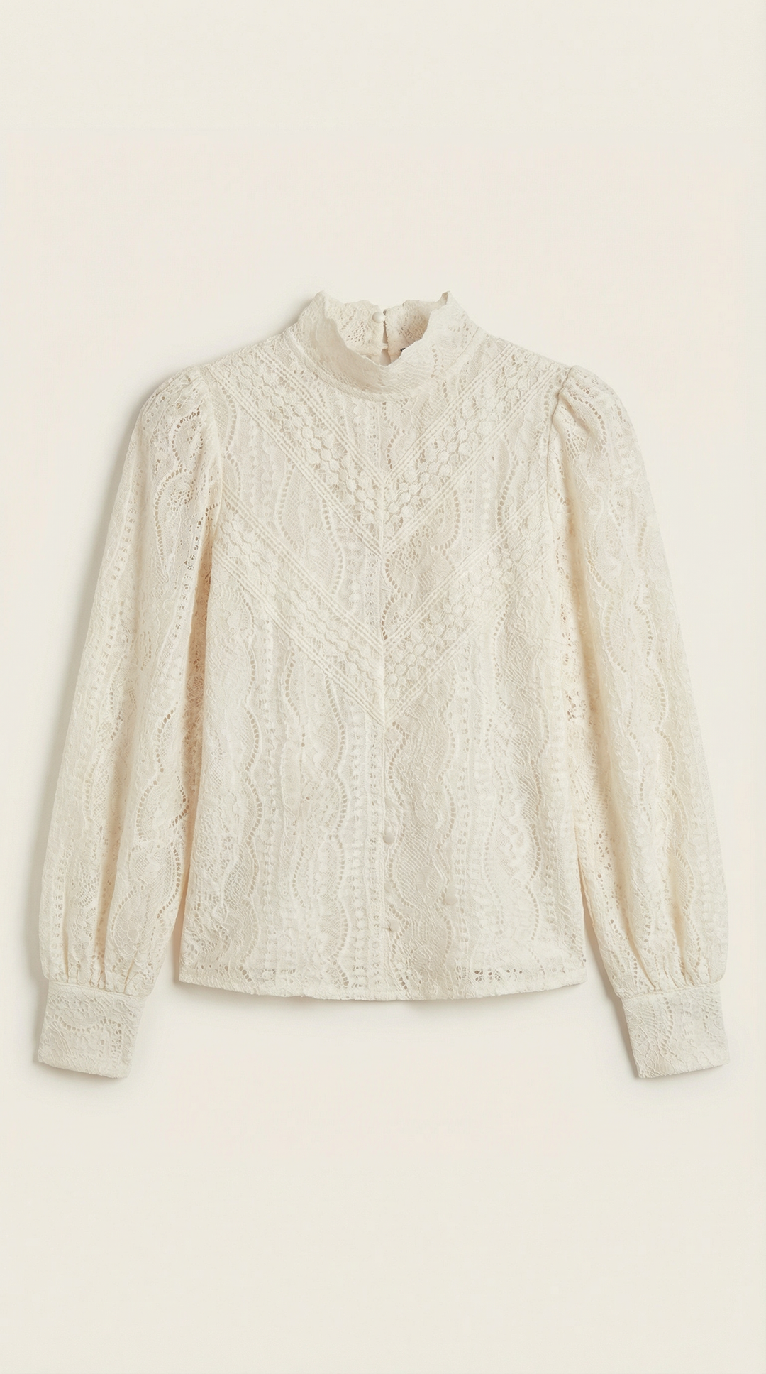 Front angled view textured blouse neutral plain background