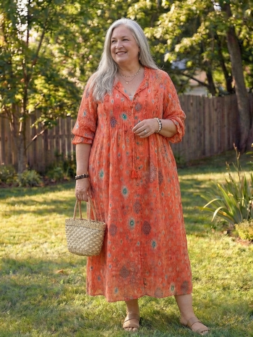 Female model showcasing a multicolor floral maxi dress with front buttons on a nature background.