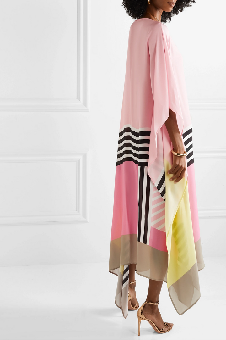 Flowing batwing sleeve kaftan worn by a model on a plain background, side way