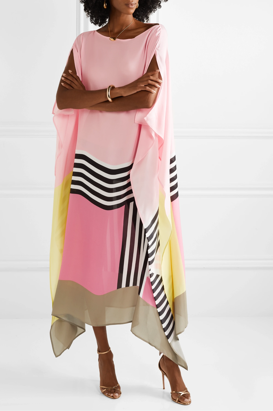 Geometric print kaftan shown on a model against a plain background.
